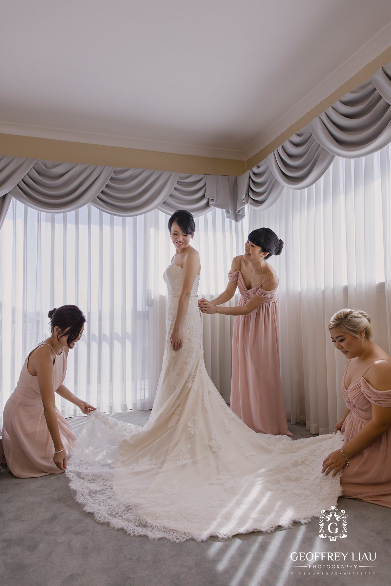 bridesmaids helping out with bride's dress